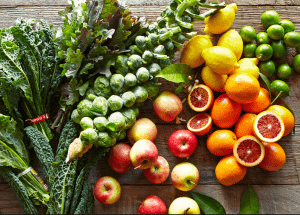 a group of fruits and vegetables on a wood surface Healthy Weight Loss Diets Colchester