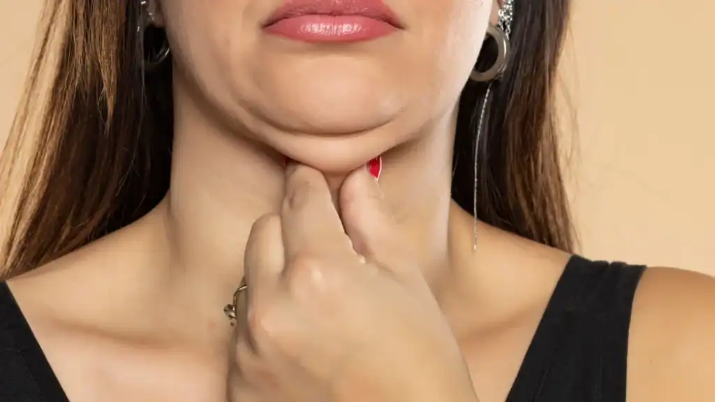 An image of a woman with double chin, sad, worried : Non Surgical Double Chin Removal Treatment in Colchester, UK